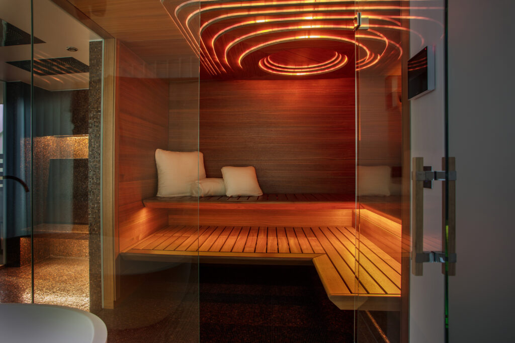 KLAFS sauna AURORA with American walnut and 3D curved ceiling Euklid